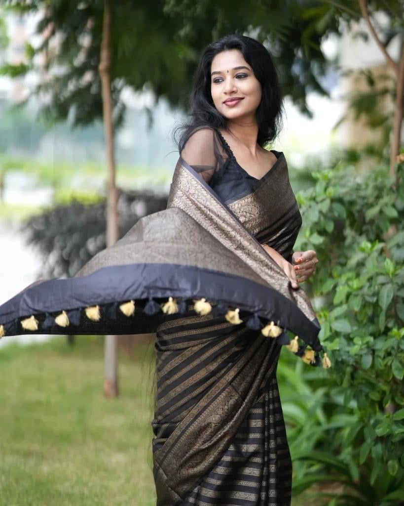 Grey Semi Silk Saree Weaved With Copper Zari Comes With Attached Blouse.