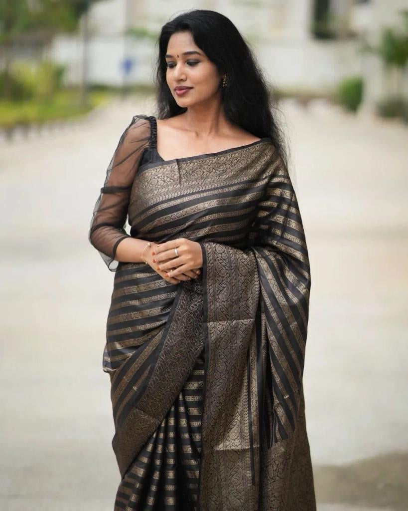 Grey Semi Silk Saree Weaved With Copper Zari Comes With Attached Blouse.