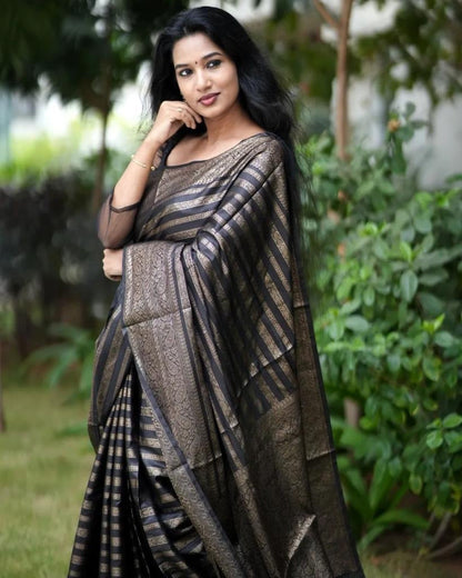 Grey Semi Silk Saree Weaved With Copper Zari Comes With Attached Blouse.